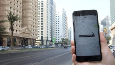 Above, an Uber application installed on a smartphone. Uber and Careem interrupted their services starting Saturday afternoon. Christopher Pike / The National
