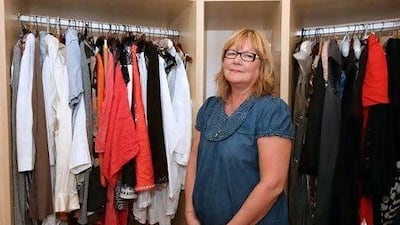 Paula Horsfall, a self-professed "recessionista", shows off some of her clothes at her apartment on the Palm Jumeirah in Dubai. Pawan Singh / The National (w)
