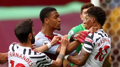 Villa's Ezri Konsa clashes with Marcus Rashford of United. EPA