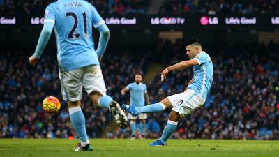 Sergio Aguero of Manchester City shoots and scores their second goal on Saturday at the Etihad Stadium. Alex Livesey / Getty Images