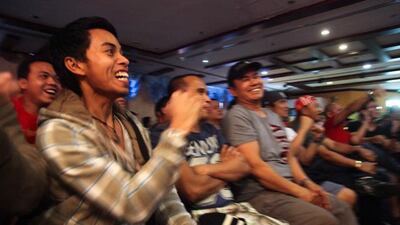 Filipino fans cheer on Pacquaio at the restaurant located on Najda and Electra Street in the capital. They gathered at the restaurant at 6:30 in the morning to watch the fight. Lee Hoagland / The National
