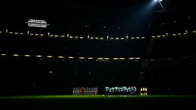 Juventus Turin's players (L) and Maccabi Haifa's players stand on the pitch during a minute of silence, after Indonesia's stadium tragedy, prior to the start of the UEFA Champions League 1st round day 3 group H football match between, at the Juventus stadium in Turin, Italy on October 5. AFP