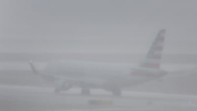 A jet takes off in wintry conditions at O'Hare International Airport, Chicago, Illinois. Getty / AFP