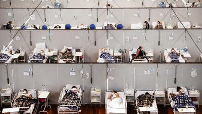 Covid-19 patients rest while being treated at a field hospital set up in the Pedro Dell’Antonia Sports Complex in Santo Andre, Brazil. Getty