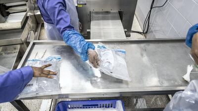 With employees working in shifts around the clock, tube ice is produced under the brand name Pure Ice. It is of a relatively cylindrical shape with a hollow core and comes in an assortment of packaging sizes. The Dubai Investment Park factory alone produces a 120 tonnes of tube ice each day. Antonie Robertson / The National