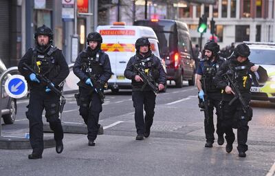 Police on Cannon Street in London near the scene of an incident on London Bridg. AP