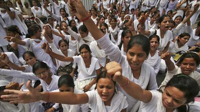 Women around the world continue to struggle to get their rights. Mukesh Gupta / Reuters