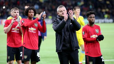 Manchester United manager Ole Gunnar Solskjaer and players applaud fans after the match against Astana. Reuters