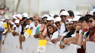 Thousands of different age groups attend for the early morning Papal mass at Bahrain National Stadium, Bahrain. Khushnum Bhandari / The National