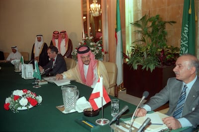 The late Saudi Foreign Minister Prince Saud Al Faisal looks at Hussein Al Husseini, the late speaker of the Lebanese parliament, during the Taif talks in 1989. AFP