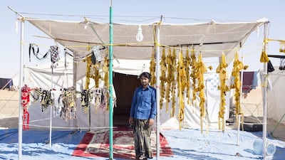 Atore vendor sells adornments for camels at the Al Dhafra Festival. The Al Dhafra Festival is held under the patronage of Sheikh Mohammed bin Zayed, Crown Prince of Abu Dhabi and Deputy Supreme Commander of the Armed Forces.