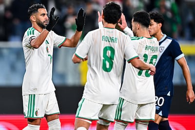 Riyad Mahrez celebrates with Algeria teammates Houssem Aouar and Mohamed Amoura after scoring in a friendly against Guatemala. Getty Images