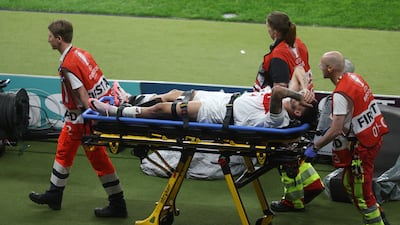 Turkey's Samet Akaydin is carried off. Getty Images