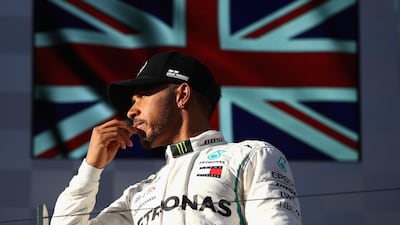 Lewis Hamilton looked despondent on the podium after the Australian Grand Prix having finished runner-up to Ferrari's Sebastian Vettel. Clive Mason / Getty Images