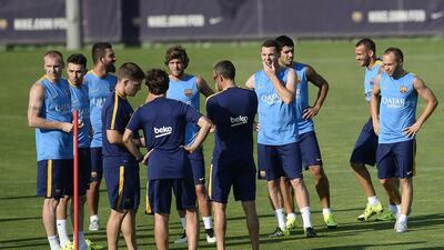Barcelona coach Luis Enrique, centre, talks to his players. Josep Lago / AFP / July 13, 2015