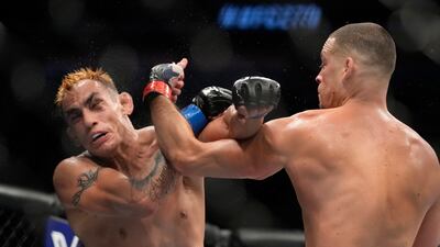 Nate Diaz throws a punch at Tony Ferguson during their welterweight bout at UFC 279. AP