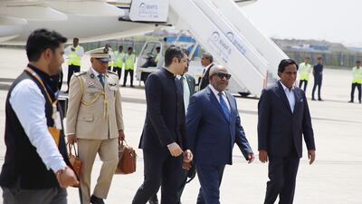 President of the Comoros and chairman of the African Union Azali Assoumani, second right, is welcomed to Delhi ahead of the G20 summit. EPA