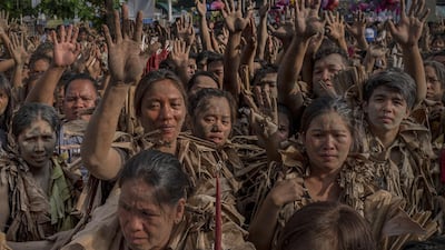 Devotees covered in mud and dried banana leaves take part in the Taong Putik ("mud people") Festival in the village of Bibiclat in Aliaga town, Nueva Ecija province, Philippines. Each year, the residents of Bibiclat village in Aliaga town celebrate the Feast of Saint John by covering themselves in mud, dried banana leaves, vines, and twigs as part of a little-known Catholic festival. Getty Images
