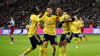 Arsenal's Pierre-Emerick Aubameyang celebrates scoring their third goal with teammates Nicolas Pepe and Gabriel Martinelli. Reuters