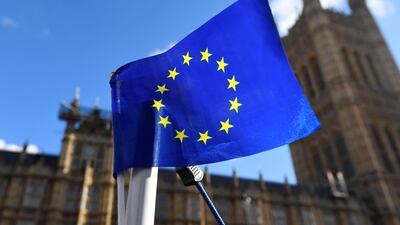 An EU flag is seen outside the Houses of Parliament in London, Britain. Reuters