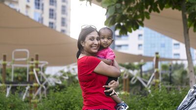Minu Mathews with her son, Caleb. Reem Mohammed / The National