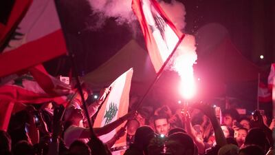 Protesters wave their national flag, during a mass protest in Martyr Square, Beirut, Lebanon, 22 November 2019. EPA