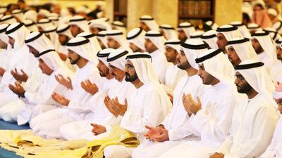 Sheikh Mohammed bin Rashid, Vice President and Prime Minister of the UAE and Ruler of Dubai, centre, leads Eid prayers ay Zabeel Mosque in Dubai. Pawan Singh / The National