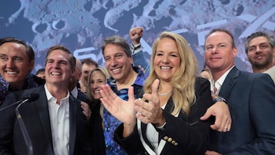 Gwynne Shotwell, president of SpaceX, is joined by company executives as they ring the opening bell at the Nasdaq. AFP