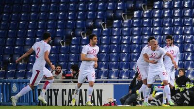 Tunisia celebrate after Wahbi Khazri, second right, equalised against Colombia on Wednesday March 5, 2014. Manu Fernandez / AP