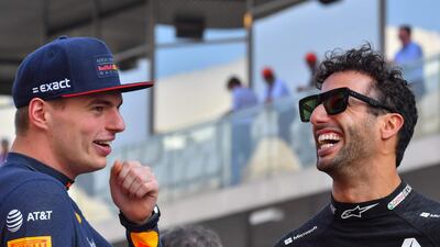Red Bull Racing's Max Verstappen, left, and Renault's Australian driver Daniel Ricciardo chat during the drivers parade. AFP