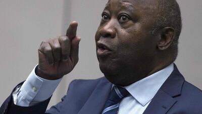 Former Ivory Coast President Laurent Gbagbo gestures as he enters the courtroom of the International Criminal Court in The Hague on January 15, 2019. AFP