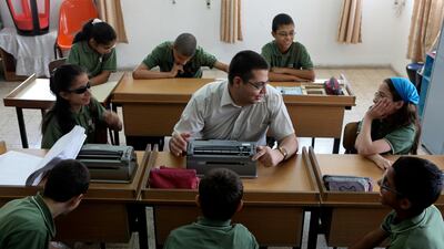 Abbass Abbass, head of the Al Manarah association, visits the Kim Al Sahes School for the visually disabled in Nazareth. Courtesy Al Manarah /