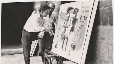 An undated image of Egyptian artist Hamed Nada standing in front of his artwork. Courtesy of ArtTalks, Egypt Archive