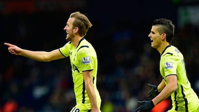 Harry Kane of Tottenham Hotspur, left, celebrates one of his two goals on Saturday with Erik Lamela, right, in Spurs' 3-0 Premier League victory over West Bromwich Albion. Stu Forster / Getty Images