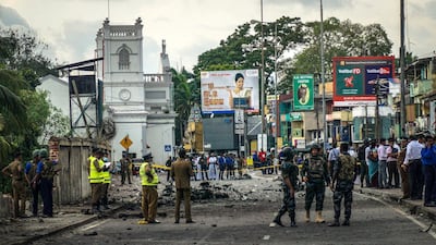 The debris of a controlled explosion in central Colombo, Sri Lanka, with St Anthony's Church in the background, April 22, 2019. Jack Moore / The National.