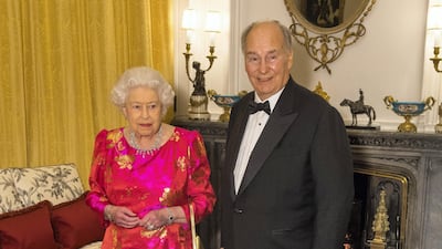 Queen Elizabeth II and the Aga Khan in the White Drawing Room at Windsor Castle, during a reception before a private dinner to mark the diamond jubilee of the Aga Khan's spiritual leadership of the Shia Ismaili Muslim Community. (PA Wire/PA Images)