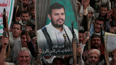 A picture of Abdul-Malik Al Houthi, leader of the Houthi rebels, is displayed at an anti-US and anti-Israel rally in the Yemeni capital Sanaa. AP
