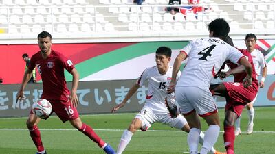 Almoez Ali shoots the score Qatar's opening goal. EPA