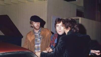 Friends Harry Nilsson, left, and John Lennon, centre, are ejected from the Troubadour nightclub in California after they heckled a performance by the Smothers Brothers in 1974. Maureen Donaldson / Getty Images