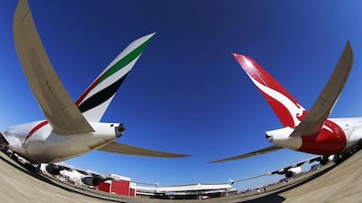 Emirates and Qantas A380 aircraft sit on the tarmac at Kingsford Smith international airport in Sydney. Daniel Munoz / Reuters