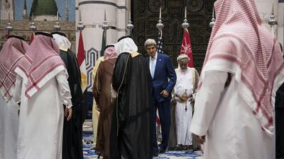 The US secretary of state John Kerry and representatives of the Gulf Cooperation Council and regional partners pose for photos at King Abdulaziz International Airport’s Royal Terminal in Jeddah, Saudi Arabia, where they met on September 11, 2014, to discuss a united front against the ISIL extremist group. Brendan Smialowski / AFP