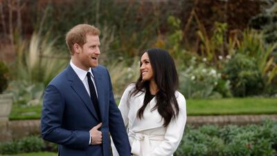 Britain's Prince Harry and his fiancee Meghan Markle pose for photographers in the grounds of Kensington Palace in London, following the announcement of their engagement. Speculation is mounting over who will be invited to the May 19, 2018, royal wedding. AP photo