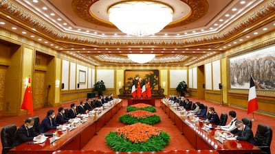 Mr Xi, centre left, and Mr Macron, centre right, at a meeting in the Great Hall of the People in Beijing. AP