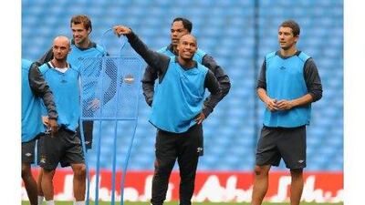 Nigel de Jong, centre, says that Manchester City have more quality in their squad than last year. Clint Hughes / Getty Images