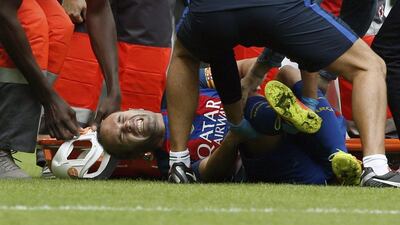 Barcelona's Andres Iniesta reacts in pain after picking up an injury during the team's match against Valencia. Juan Carlos Cardenas / EPA / October 22, 2016