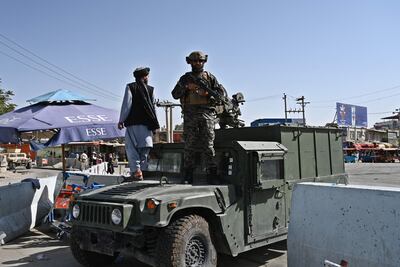 A Taliban Badri fighter stands guard at Kabul airport following the Taliban's military takeover of Afghanistan. AFP
