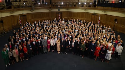 Newly elected Prime Minister Mr Starmer stands with Labour MPs, at Church House in Westminster in July 2024