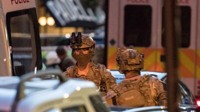 Armed officers are seen on the street outside Borough Market the morning after a terror attack on London Bridge and the Borough area in London. Chris Ratcliffe / AFP
