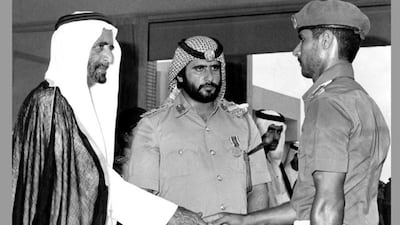 Sheikh Ahmed, centre, with his father Sheikh Rashid bin Saeed Al Maktoum at a police graduation ceremony in the 1970s. Photo: Sheikh Ahmed bin Rashid