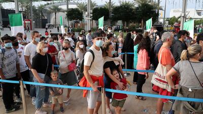 Visitors outside the Italy pavilion, which was also closed for some time so rain damage could be repaired.